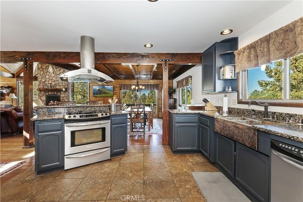 Dining room, Fireplace, Interior, Kitchen, Recessed Lighting, Stainless Steel Appliances, Stone Walls, Wooden Beams