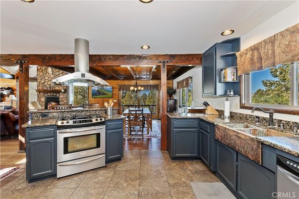Dining room, Fireplace, Interior, Kitchen, Recessed Lighting, Stainless Steel Appliances, Stone Walls, Wooden Beams