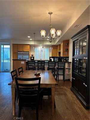 Chandelier, Dining room, Interior, Kitchen, Pendant Lights, Recessed Lighting, Stainless Steel Appliances, Wood Texture Flooring