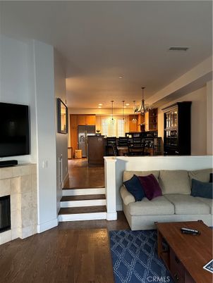 Dining room, Fireplace, Interior, Kitchen, Living room, Pendant Lights, Recessed Lighting, Stainless Steel Appliances, Wood Texture Flooring