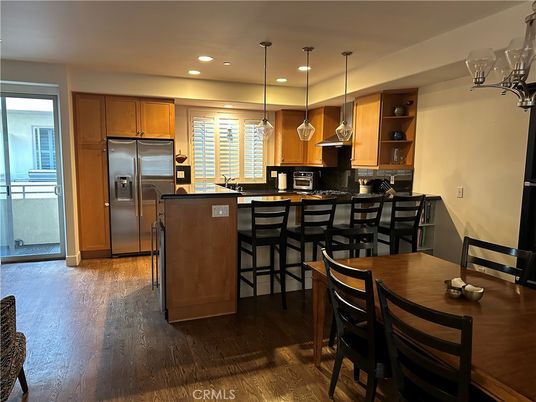 Dining room, Interior, Kitchen, Pendant Lights, Recessed Lighting, Stainless Steel Appliances, Wood Texture Flooring
