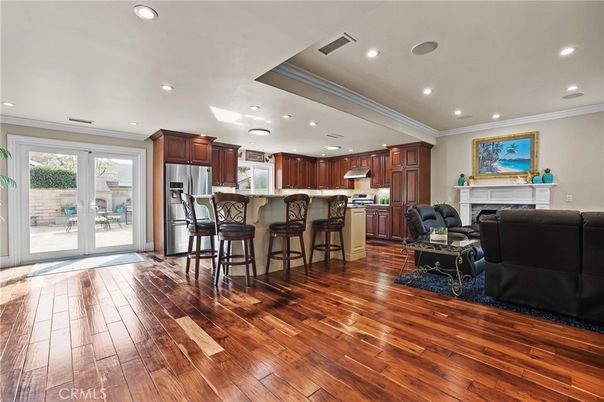 Fireplace, Interior, Kitchen, Living room, Recessed Lighting, Stainless Steel Appliances, Wood Texture Flooring