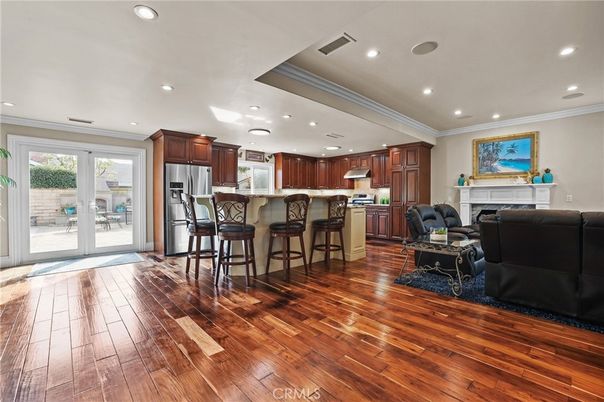 Fireplace, Interior, Kitchen, Living room, Recessed Lighting, Stainless Steel Appliances, Wood Texture Flooring