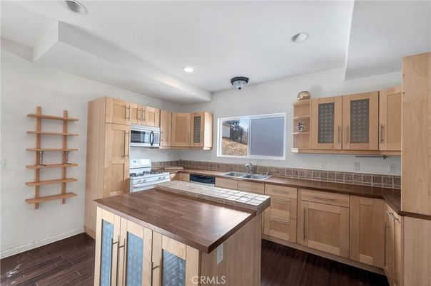 Interior, Kitchen, Recessed Lighting, Stainless Steel Appliances, Tile Countertops, Wood Texture Flooring