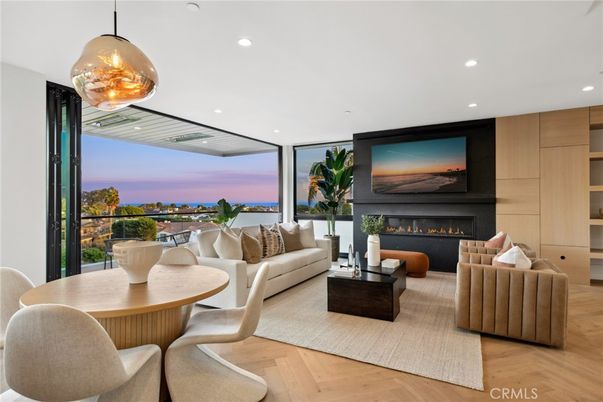 Dining room, Fireplace, Interior, Living room, Pendant Lights, Recessed Lighting, Water, Wood Texture Flooring