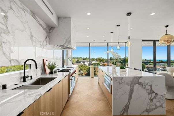 Interior, Kitchen, Marble Walls, Pendant Lights, Recessed Lighting, Stainless Steel Appliances, Wood Texture Flooring