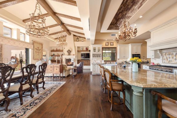 Chandelier, Dining room, Fireplace, Interior, Kitchen, Living room, Recessed Lighting, Stainless Steel Appliances, Wood Texture Flooring