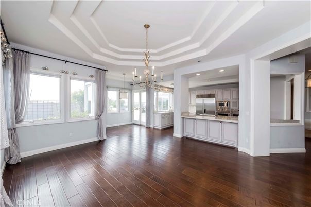 Chandelier, Empty room, Interior, Kitchen, Pendant Lights, Recessed Lighting, Stainless Steel Appliances, Wood Texture Flooring
