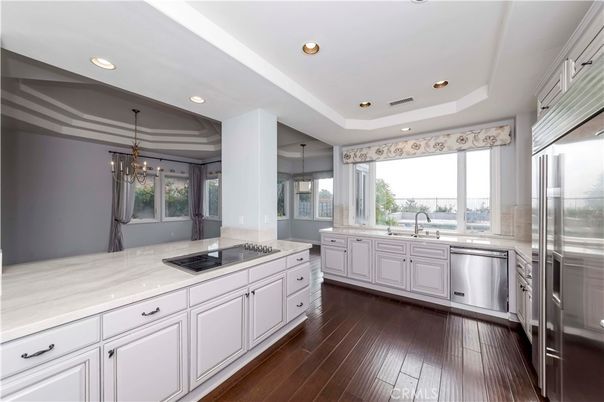 Chandelier, Interior, Kitchen, Pendant Lights, Recessed Lighting, Stainless Steel Appliances, Wood Texture Flooring