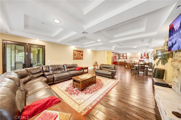 Dining room, Fireplace, Interior, Living room, Recessed Lighting, Wood Texture Flooring