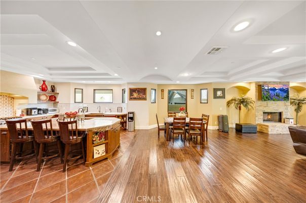 Dining room, Fireplace, Interior, Kitchen, Recessed Lighting, Wood Texture Flooring