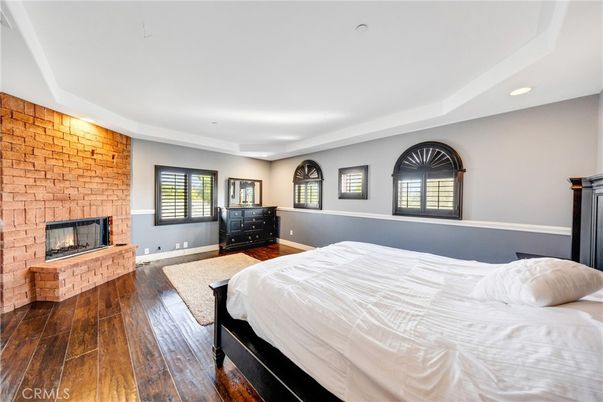 Bedroom, Fireplace, Interior, Recessed Lighting, Stone Walls, Wood Texture Flooring
