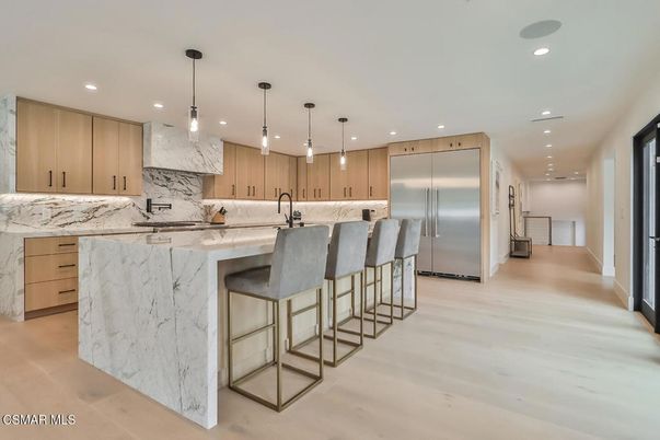 Interior, Kitchen, Marble Walls, Pendant Lights, Recessed Lighting, Stainless Steel Appliances, Wood Texture Flooring