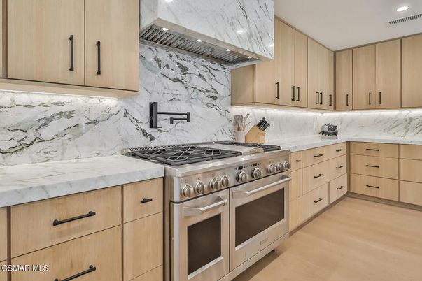 Interior, Kitchen, Marble Walls, Recessed Lighting, Stainless Steel Appliances