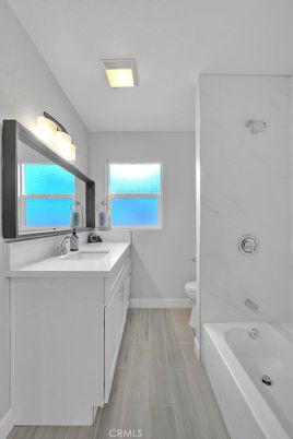 Bathroom, Dual Sink Vanities, Interior, Marble Walls, Wood Texture Flooring