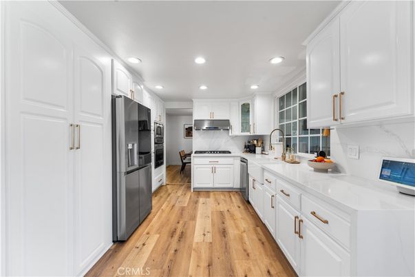 Interior, Kitchen, Marble Walls, Stainless Steel Appliances, Wood Texture Flooring