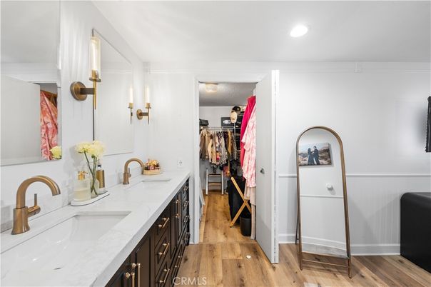 Bathroom, Dual Sink Vanities, Interior, Recessed Lighting, Walk-in Closets, Wood Texture Flooring