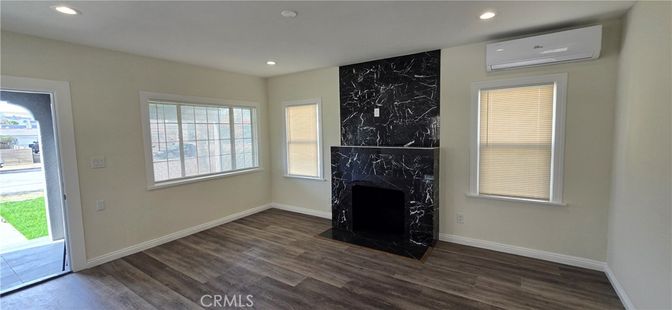 Fireplace, Interior, Marble Walls, Recessed Lighting, Wood Texture Flooring