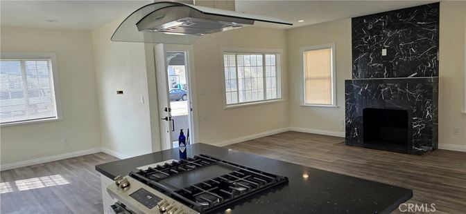 Fireplace, Interior, Kitchen, Marble Walls, Recessed Lighting, Wood Texture Flooring