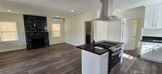 Fireplace, Interior, Kitchen, Marble Walls, Recessed Lighting, Wood Texture Flooring