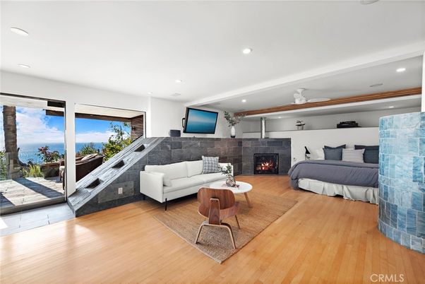 Bedroom, Fireplace, Interior, Living room, Recessed Lighting, Water, Wood Texture Flooring