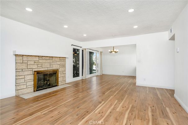 Chandelier, Empty room, Fireplace, Interior, Recessed Lighting, Wood Texture Flooring