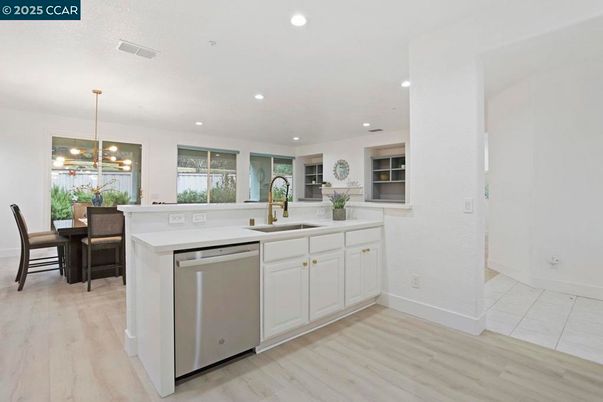 Dining room, Interior, Kitchen, Pendant Lights, Recessed Lighting, Stainless Steel Appliances, Wood Texture Flooring