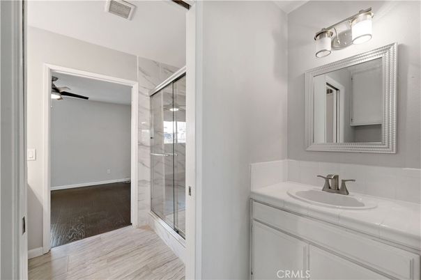 Bathroom, Glass Shower, Interior, Tile Countertops, Wood Texture Flooring