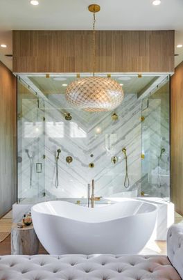 Bathroom, Free Standing Baths, Glass Shower, Interior, Marble Walls, Pendant Lights, Recessed Lighting, Wood Texture Flooring