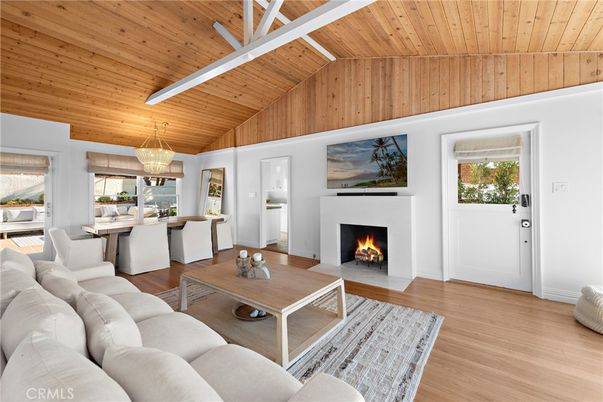 Chandelier, Dining room, Fireplace, Interior, Living room, Pendant Lights, Wooden Ceilings, Wood Texture Flooring