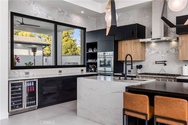 Interior, Kitchen, Marble Walls, Recessed Lighting, Stainless Steel Appliances
