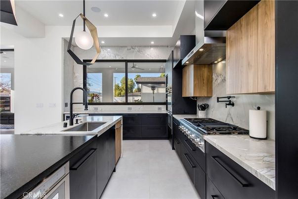 Interior, Kitchen, Marble Walls, Pendant Lights, Recessed Lighting, Stainless Steel Appliances
