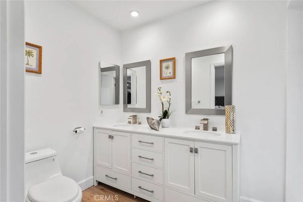 Bathroom, Dual Sink Vanities, Interior, Recessed Lighting, Wood Texture Flooring