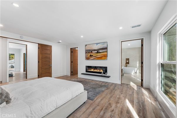 Bedroom, Fireplace, Interior, Recessed Lighting, Wood Texture Flooring