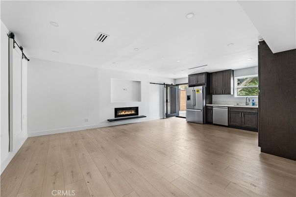 Empty room, Fireplace, Interior, Kitchen, Recessed Lighting, Wood Texture Flooring