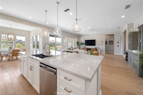 Dining room, Interior, Kitchen, Pendant Lights, Recessed Lighting, Stainless Steel Appliances, Wood Texture Flooring