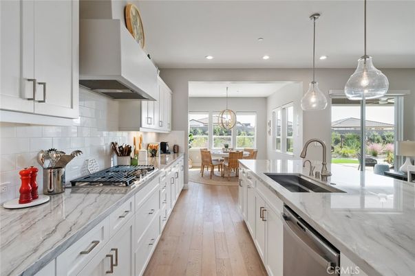 Dining room, Interior, Kitchen, Pendant Lights, Recessed Lighting, Stainless Steel Appliances, Wood Texture Flooring