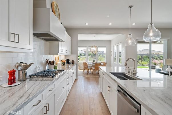Dining room, Interior, Kitchen, Pendant Lights, Recessed Lighting, Stainless Steel Appliances, Wood Texture Flooring