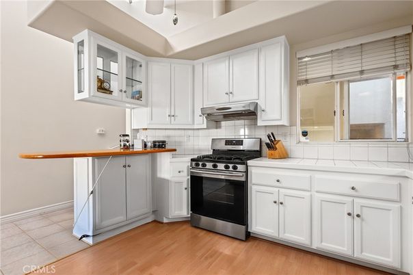 Interior, Kitchen, Stainless Steel Appliances, Tile Countertops, Wood Texture Flooring