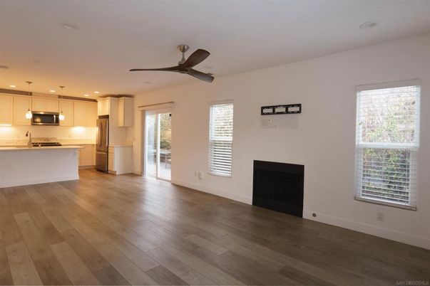Empty room, Fireplace, Interior, Kitchen, Pendant Lights, Recessed Lighting, Wood Texture Flooring