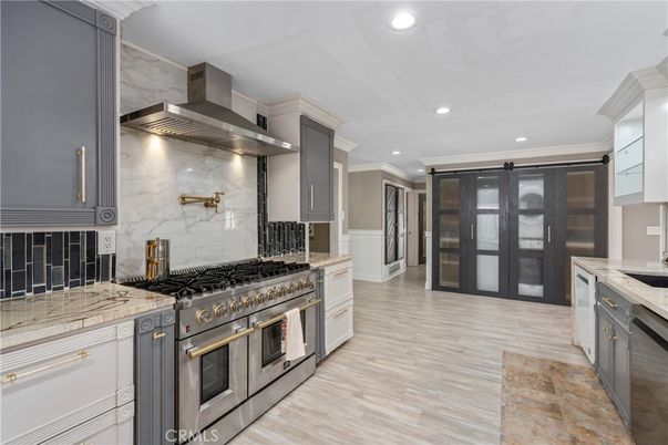 Interior, Kitchen, Marble Walls, Recessed Lighting, Stainless Steel Appliances, Wood Texture Flooring