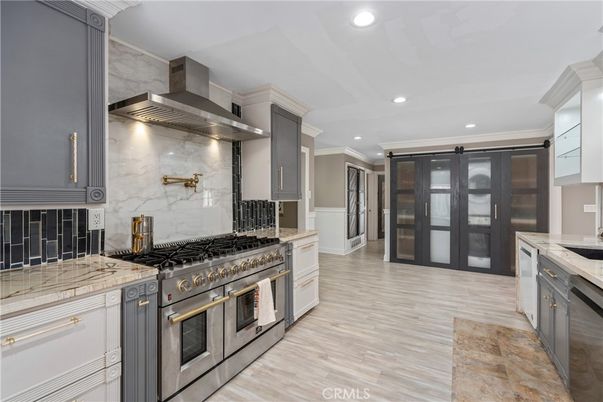 Interior, Kitchen, Marble Walls, Recessed Lighting, Stainless Steel Appliances, Wood Texture Flooring