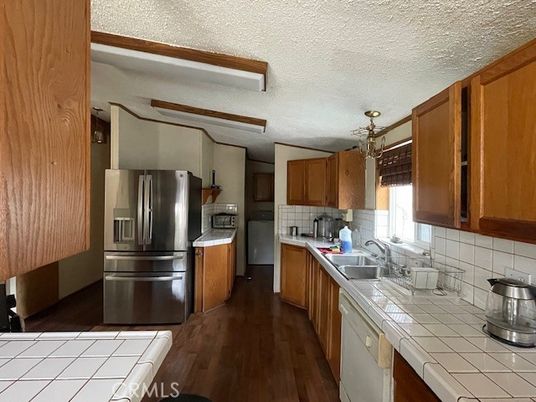 Interior, Kitchen, Stainless Steel Appliances, Tile Countertops, Wood Texture Flooring