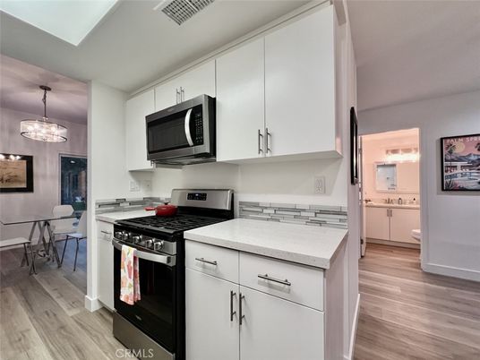 Dining room, Interior, Kitchen, Pendant Lights, Stainless Steel Appliances, Wood Texture Flooring