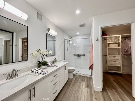 Bathroom, Dual Sink Vanities, Glass Shower, Interior, Recessed Lighting, Walk-in Closets, Wood Texture Flooring