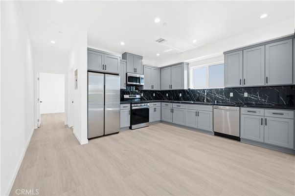 Interior, Kitchen, Recessed Lighting, Stainless Steel Appliances, Wood Texture Flooring