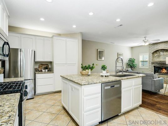 Fireplace, Interior, Kitchen, Living room, Recessed Lighting, Stainless Steel Appliances, Stone Walls, Wood Texture Flooring