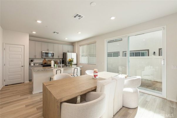 Dining room, Interior, Kitchen, Recessed Lighting, Stainless Steel Appliances, Wood Texture Flooring