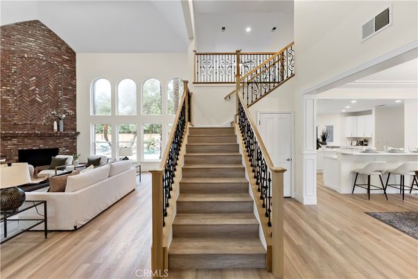 Fireplace, Interior, Kitchen, Living room, Recessed Lighting, Stone Walls, Wood Texture Flooring