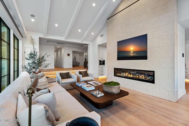 Fireplace, Interior, Living room, Recessed Lighting, Stone Walls, Wood Texture Flooring